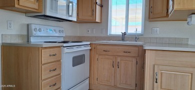 Park model with a separate shed that includes a Roper/Whirlpool on Great Eagle Golf Club in Arizona - for sale on GolfHomes.com, golf home, golf lot