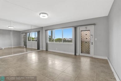 BEST VALUE IN CAMBRIDGE FOR ONE A BEDROOM! IMPACT WINDOWS FRONT on Hillsboro Pines Golf in Florida - for sale on GolfHomes.com, golf home, golf lot