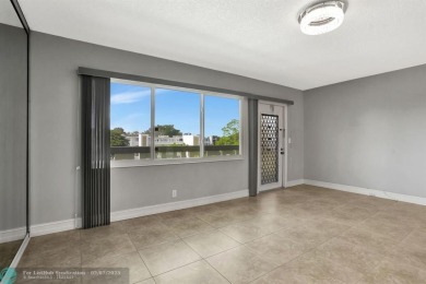 BEST VALUE IN CAMBRIDGE FOR ONE A BEDROOM! IMPACT WINDOWS FRONT on Hillsboro Pines Golf in Florida - for sale on GolfHomes.com, golf home, golf lot