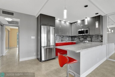 BEST VALUE IN CAMBRIDGE FOR ONE A BEDROOM! IMPACT WINDOWS FRONT on Hillsboro Pines Golf in Florida - for sale on GolfHomes.com, golf home, golf lot