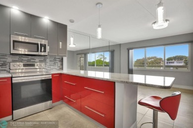 BEST VALUE IN CAMBRIDGE FOR ONE A BEDROOM! IMPACT WINDOWS FRONT on Hillsboro Pines Golf in Florida - for sale on GolfHomes.com, golf home, golf lot