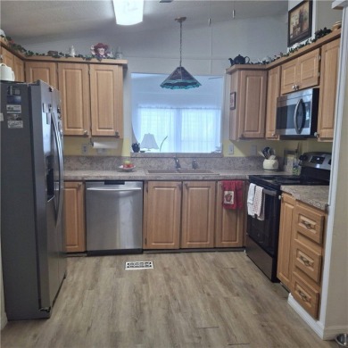 A great location for year-round or seasonal use. Within walking on Barefoot Bay Golf Course in Florida - for sale on GolfHomes.com, golf home, golf lot