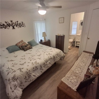 A great location for year-round or seasonal use. Within walking on Barefoot Bay Golf Course in Florida - for sale on GolfHomes.com, golf home, golf lot