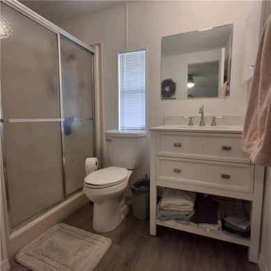A great location for year-round or seasonal use. Within walking on Barefoot Bay Golf Course in Florida - for sale on GolfHomes.com, golf home, golf lot