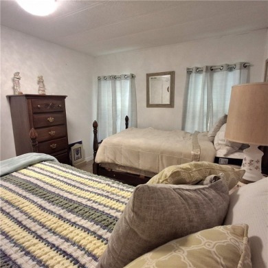 A great location for year-round or seasonal use. Within walking on Barefoot Bay Golf Course in Florida - for sale on GolfHomes.com, golf home, golf lot