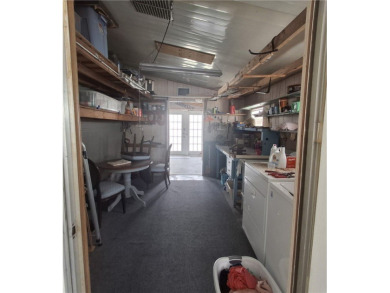 A great location for year-round or seasonal use. Within walking on Barefoot Bay Golf Course in Florida - for sale on GolfHomes.com, golf home, golf lot
