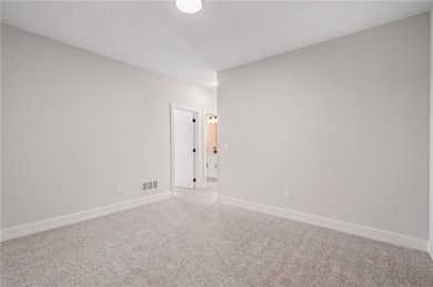 Discover modern, low-maintenance luxury living in this stunning on The Golf Club of Kansas in Kansas - for sale on GolfHomes.com, golf home, golf lot