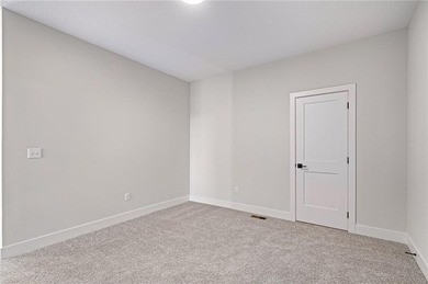 Discover modern, low-maintenance luxury living in this stunning on The Golf Club of Kansas in Kansas - for sale on GolfHomes.com, golf home, golf lot