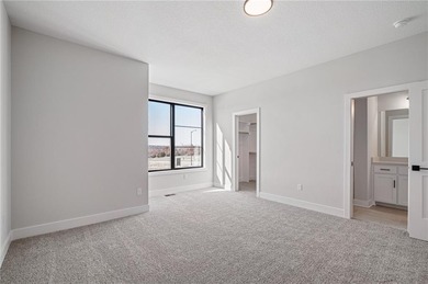 Discover modern, low-maintenance luxury living in this stunning on The Golf Club of Kansas in Kansas - for sale on GolfHomes.com, golf home, golf lot