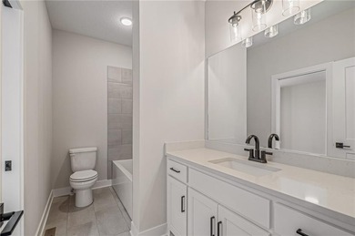 Discover modern, low-maintenance luxury living in this stunning on The Golf Club of Kansas in Kansas - for sale on GolfHomes.com, golf home, golf lot