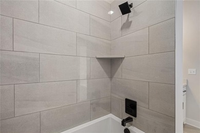 Discover modern, low-maintenance luxury living in this stunning on The Golf Club of Kansas in Kansas - for sale on GolfHomes.com, golf home, golf lot