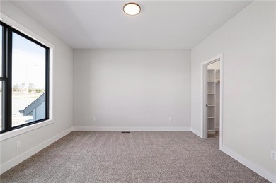 Discover modern, low-maintenance luxury living in this stunning on The Golf Club of Kansas in Kansas - for sale on GolfHomes.com, golf home, golf lot