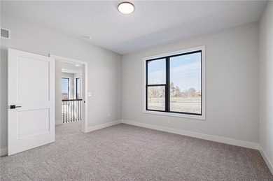 Discover modern, low-maintenance luxury living in this stunning on The Golf Club of Kansas in Kansas - for sale on GolfHomes.com, golf home, golf lot