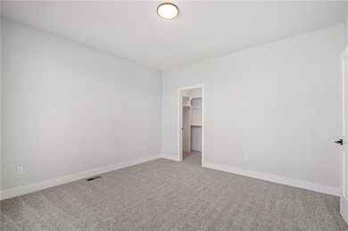 Discover modern, low-maintenance luxury living in this stunning on The Golf Club of Kansas in Kansas - for sale on GolfHomes.com, golf home, golf lot