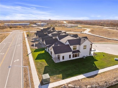 Discover modern, low-maintenance luxury living in this stunning on The Golf Club of Kansas in Kansas - for sale on GolfHomes.com, golf home, golf lot
