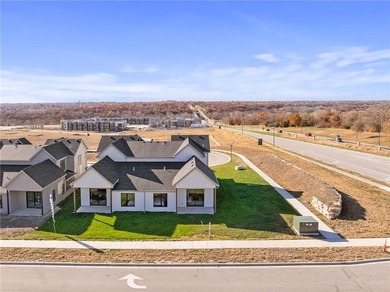 Discover modern, low-maintenance luxury living in this stunning on The Golf Club of Kansas in Kansas - for sale on GolfHomes.com, golf home, golf lot