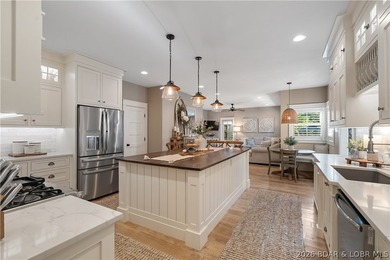 Resort-style luxury in coveted Osage National! This fully on Osage National Golf Club in Missouri - for sale on GolfHomes.com, golf home, golf lot