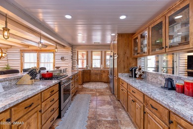 Pinetop Country Club stunning log cabin designed for comfort on Pinetop Lakes Country Club in Arizona - for sale on GolfHomes.com, golf home, golf lot