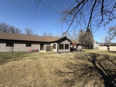 Nestled on a serene treed lot, this stunning one-story on Devils Lake Town and Country Club in North Dakota - for sale on GolfHomes.com, golf home, golf lot