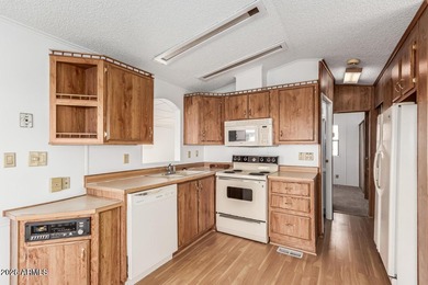 This move-in-ready home offers peace of mind with a brand-new AC on Great Eagle Golf Club in Arizona - for sale on GolfHomes.com, golf home, golf lot