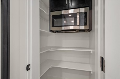 Discover modern, low-maintenance luxury living in this stunning on The Golf Club of Kansas in Kansas - for sale on GolfHomes.com, golf home, golf lot