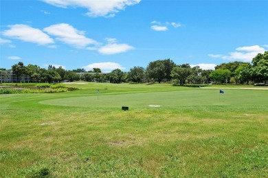 This appealing move-in ready townhome located in desirable on Pine Island Ridge Country Club in Florida - for sale on GolfHomes.com, golf home, golf lot