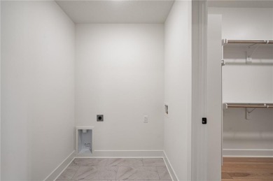 Discover modern, low-maintenance luxury living in this stunning on The Golf Club of Kansas in Kansas - for sale on GolfHomes.com, golf home, golf lot