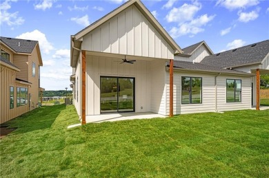 Discover modern, low-maintenance luxury living in this stunning on The Golf Club of Kansas in Kansas - for sale on GolfHomes.com, golf home, golf lot