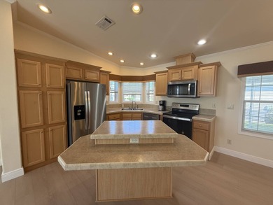 Spacious mobile home in a desirable and active community.  Step on Water Oak Country Club Estates in Florida - for sale on GolfHomes.com, golf home, golf lot