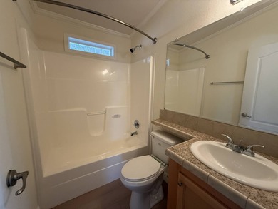 Spacious mobile home in a desirable and active community.  Step on Water Oak Country Club Estates in Florida - for sale on GolfHomes.com, golf home, golf lot