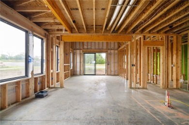 Discover modern, low-maintenance luxury living in this stunning on The Golf Club of Kansas in Kansas - for sale on GolfHomes.com, golf home, golf lot