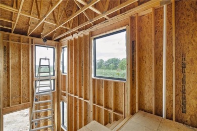 Discover modern, low-maintenance luxury living in this stunning on The Golf Club of Kansas in Kansas - for sale on GolfHomes.com, golf home, golf lot