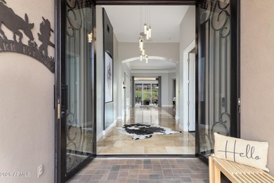 This exceptional home showcases a stunning open-concept design on Superstition Mountain Club - Lost Gold in Arizona - for sale on GolfHomes.com, golf home, golf lot