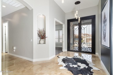 This exceptional home showcases a stunning open-concept design on Superstition Mountain Club - Lost Gold in Arizona - for sale on GolfHomes.com, golf home, golf lot