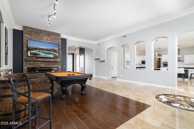 This exceptional home showcases a stunning open-concept design on Superstition Mountain Club - Lost Gold in Arizona - for sale on GolfHomes.com, golf home, golf lot