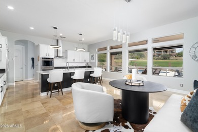 This exceptional home showcases a stunning open-concept design on Superstition Mountain Club - Lost Gold in Arizona - for sale on GolfHomes.com, golf home, golf lot