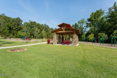 Custom crafted ranch home in desirable Heritage Wake Forest! Set on Heritage Golf Club in North Carolina - for sale on GolfHomes.com, golf home, golf lot