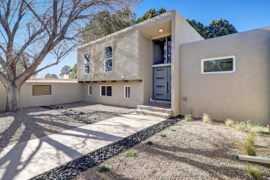 An amazing contemporary split-level home near Arroyo Del Oso on Arroyo Del Oso Golf Course in New Mexico - for sale on GolfHomes.com, golf home, golf lot