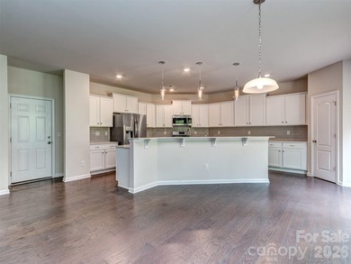 Welcome home to Killian Creek! Large, rocking chair, covered on Verdict Ridge Golf and Country Club in North Carolina - for sale on GolfHomes.com, golf home, golf lot