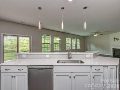 Welcome home to Killian Creek! Large, rocking chair, covered on Verdict Ridge Golf and Country Club in North Carolina - for sale on GolfHomes.com, golf home, golf lot