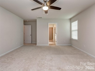 Welcome home to Killian Creek! Large, rocking chair, covered on Verdict Ridge Golf and Country Club in North Carolina - for sale on GolfHomes.com, golf home, golf lot