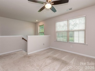 Welcome home to Killian Creek! Large, rocking chair, covered on Verdict Ridge Golf and Country Club in North Carolina - for sale on GolfHomes.com, golf home, golf lot