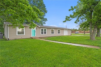 This remodeled ranch home in a gated community boasts four on Linn Valley Lakes - Deer Trace Golf Course in Kansas - for sale on GolfHomes.com, golf home, golf lot