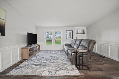 This remodeled ranch home in a gated community boasts four on Linn Valley Lakes - Deer Trace Golf Course in Kansas - for sale on GolfHomes.com, golf home, golf lot