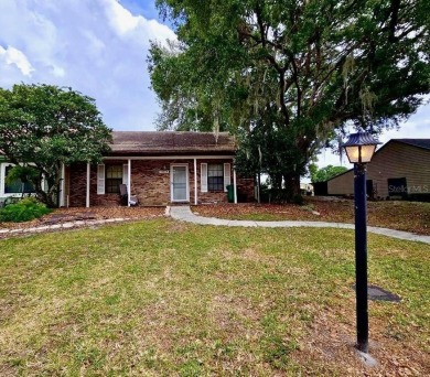 Welcome to Whispering Oaks Estates, where maintenance-free on The Ridge Manor Oaks Golf and Country Club in Florida - for sale on GolfHomes.com, golf home, golf lot