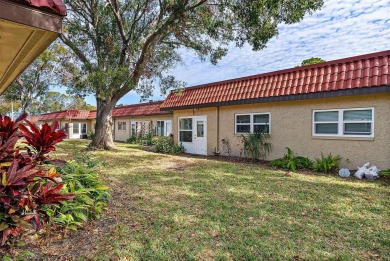 Welcome to this 55+ community of Pinewood Village.  This bright on Clearwater Executive Golf Course in Florida - for sale on GolfHomes.com, golf home, golf lot