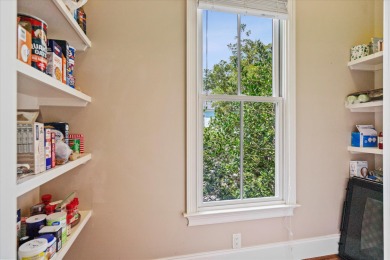Nestled on a picturesque tree-lined street, this expansive home on Charleston National Golf Club in South Carolina - for sale on GolfHomes.com, golf home, golf lot