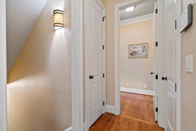 Nestled on a picturesque tree-lined street, this expansive home on Charleston National Golf Club in South Carolina - for sale on GolfHomes.com, golf home, golf lot