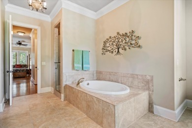 Nestled on a picturesque tree-lined street, this expansive home on Charleston National Golf Club in South Carolina - for sale on GolfHomes.com, golf home, golf lot