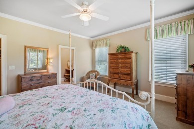 Nestled on a picturesque tree-lined street, this expansive home on Charleston National Golf Club in South Carolina - for sale on GolfHomes.com, golf home, golf lot